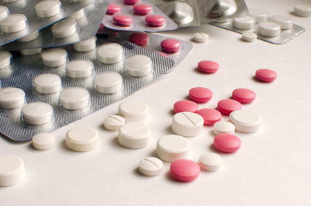 Tablets in blisters lie on top of each other. Close-up