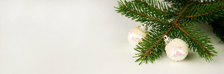 Silver Christmas tree decoration on a white background. Banner