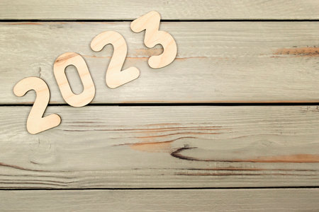 Happy New Year 2023. Symbol from number 2023 on wooden backgroundの写真素材