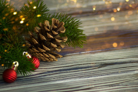 Christmas toys on the background of a green spruce branch