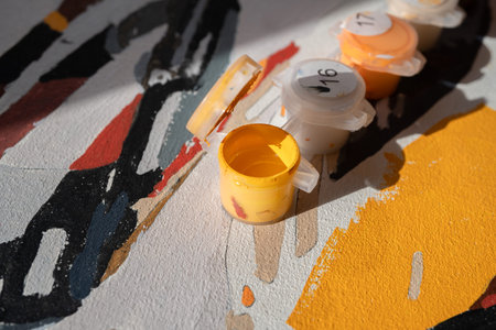 Paintings by numbers. acrylic paints lie on canvas