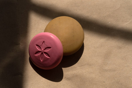 A set of handmade soaps lies on wrapping paperの写真素材