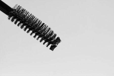 brush of mascara or cosmetic gel for eyebrows and eyelashes close-up