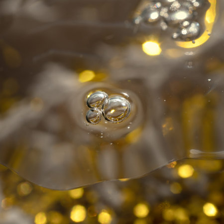 air bubbles and glitter in cosmetic serum on a festive background for advertising and presentation...