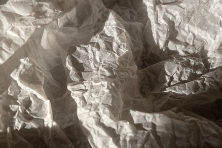 A crumpled piece of kraft paper lies on the surfaceの写真素材