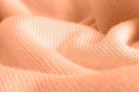 Wool sweater texture close up. Soft focus. Color peach fuzzの写真素材
