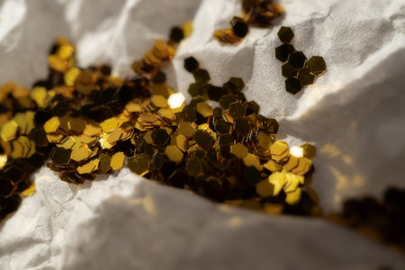 Glitter lies on crumpled wrapping paper. Festive backgroundの写真素材