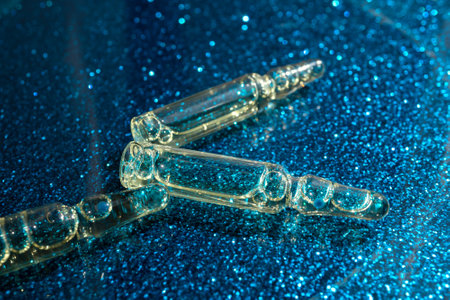Glass ampoules are on the tableの写真素材