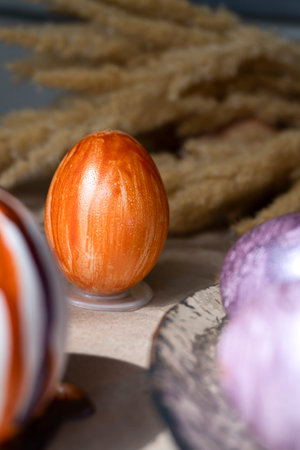 Beautiful Easter eggs lie on the table in craft paperの写真素材
