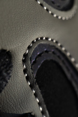 A fragment of a black sneaker. Close-up