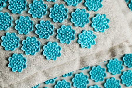 Close-up of orthopedic acupressure mat and pillows for self health massage at home and indoors. The concept of healthの写真素材