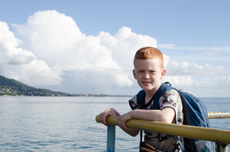 Teenager on the sea pier. Traveling during the holidaysの写真素材
