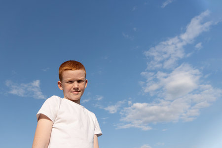 Portrait of a Child enjoying the fresh air and sunの写真素材