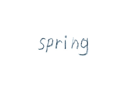 Handwritten word SPRING written by a child's hand