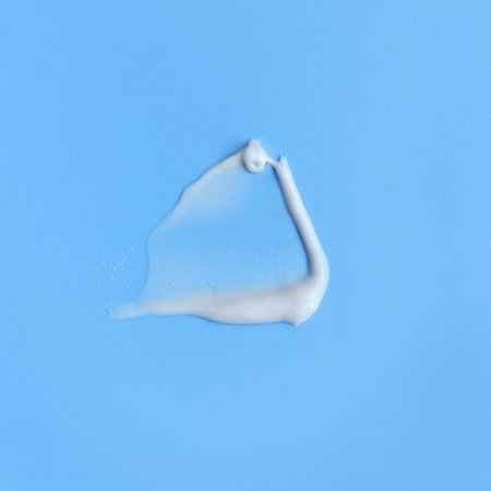 face cream on a blue background. Smear of cosmetic product on a light backgroundの写真素材
