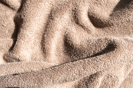 Fluffy terry brown towel. Background for your backgroundの写真素材