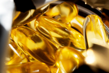 Bottle with soft yellow capsules. Health concept
