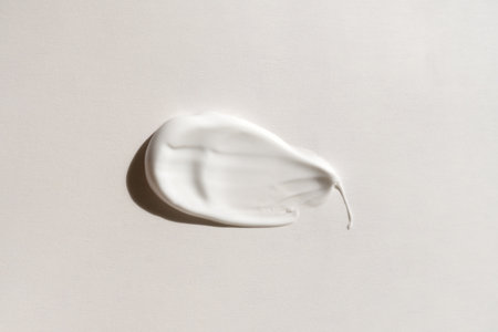 Cream smeared on light backgroundの写真素材