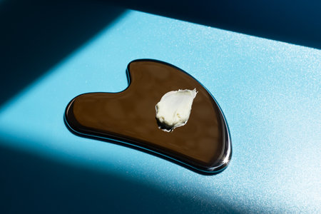 A smear of cream on a gua sha scraperの写真素材