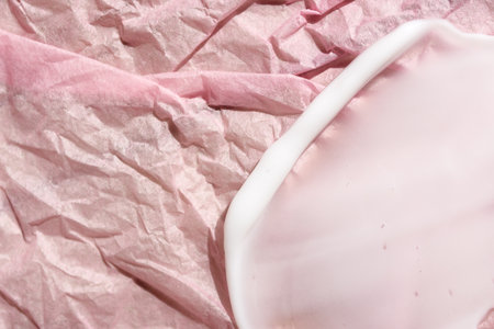 Green cream smeared over white backgroundの写真素材