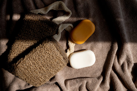 Soap, washcloth on a brown towel. Skin and hair careの写真素材