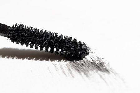 Mascara brush with mascara stroke isolated on white backgroundの写真素材