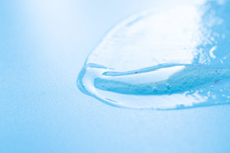 Drop of cosmetic product on a blue backgroundの写真素材