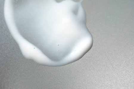 Cream smeared over white background