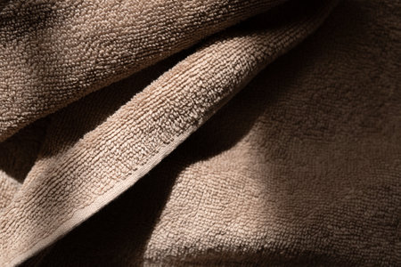Fluffy terry beige towel. Background for your backgroundの写真素材
