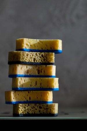 Sponges or sponges for washing dishes, cleaning in the kitchen or bathroom lie on the surfaceの写真素材