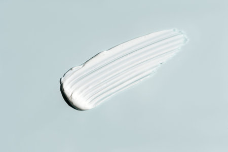 cosmetic smears cream texture on pastel blue background