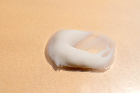 face cream and scrubs on a light background. Smear of cosmetic product on a light background