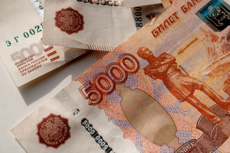 Banknotes of Russia. Money is scattered on a light surface. Close-up of money