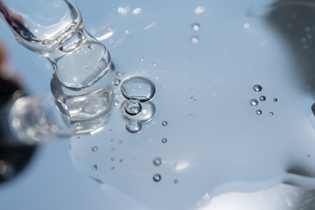 pipette with oil lies on a metal surfaces