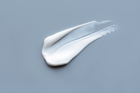 A smear of cream on a light background. Beauty concept.の写真素材