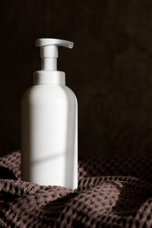 Soap or shower gel on a waffle brown towelの写真素材