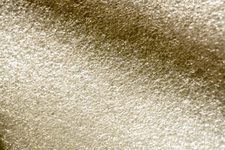 Wrapping an item in textured bubble wrap for shipping. non-ecological packaging of goods for your businessの写真素材