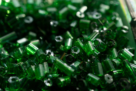 Textured background made of green glass beads.