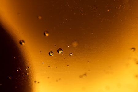 surface of oil or serum with bubbles. festive cosmetic background. Blurred background