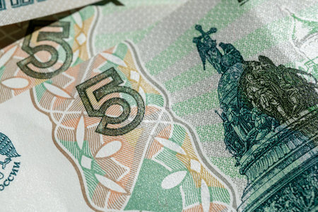 Money is scattered on the surface. Close-up of denominations of five Russian rublesの写真素材
