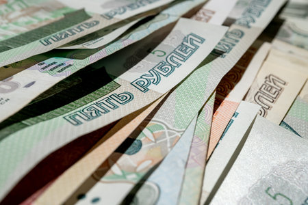 Paper banknotes of Russian rubles of different denominations in a stack close-up