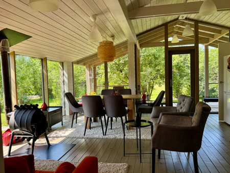 Modern and stylish interior of a country house on a summer day. High quality photoの写真素材