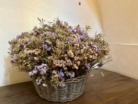 A basket of dried flowers in the room. High quality photoの写真素材