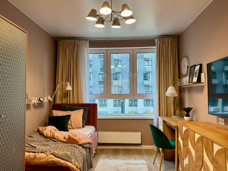 a modern bedroom in a stylish interior of a new apartment with designer renovation. High quality photoの写真素材