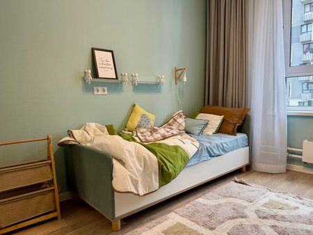 a modern children's room in a stylish interior of a new apartment in bright colors. High quality photoの写真素材