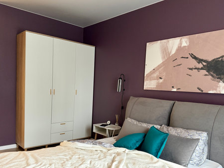 a modern bedroom in a stylish interior of a new apartment with designer renovation. High quality photoの写真素材