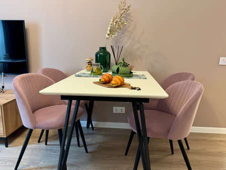 Dining area in the kitchen, table and chairs in a modern apartment. High quality photoの写真素材