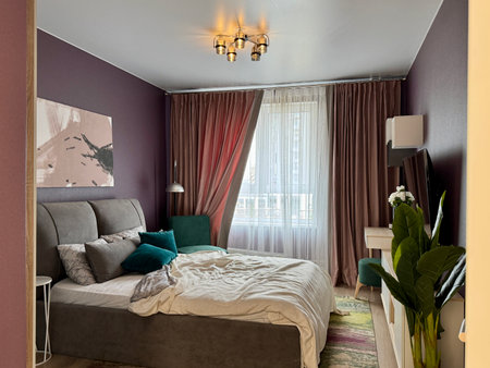 a modern bedroom in a stylish interior of a new apartment with designer renovation. High quality photoの写真素材