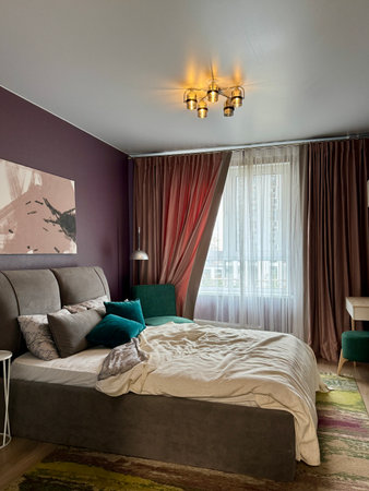 a modern bedroom in a stylish interior of a new apartment with designer renovation. High quality photoの写真素材