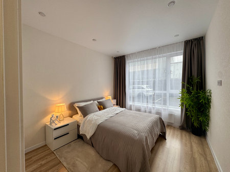 a modern bedroom in a stylish interior of a new apartment with designer renovation. High quality photoの写真素材
